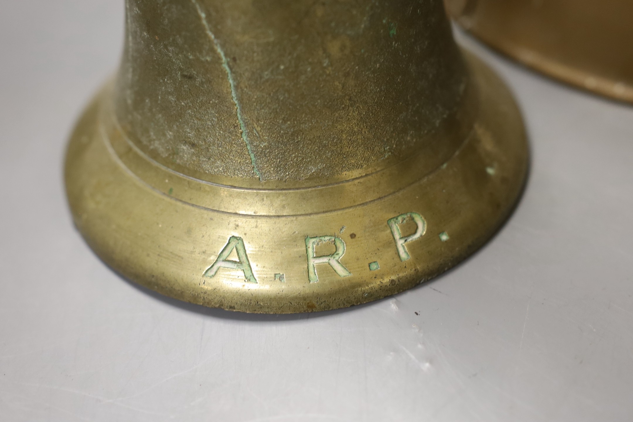 Two World War Two hand-bells, 26cm, and a brass wartime loud-haler